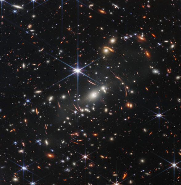 Image from the James Webb Space Telescope of a deep field. Thousands of galaxies can be seen on a black canvas. 
