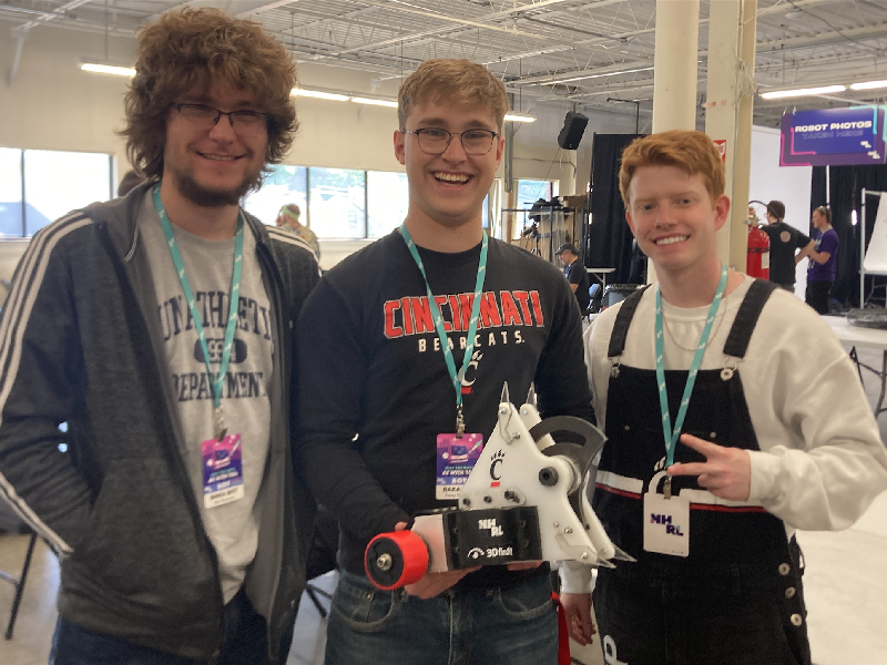 Members of the University of Cincinnati's Combat Robotics (BattleBots) team pose with BAKA BOT, which has a 3Dfindit sticker on it.